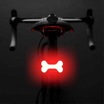 3664 Luz trasera creativa para bicicleta IPX2 impermeable Luz LED pequeña para bicicleta con soporte de carga USB para ciclismo al aire libre - Hueso