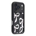 Elegante funda de TPU antichoque para iPhone 17 Pro Max con bordes elevados - Negro / Lazo grande